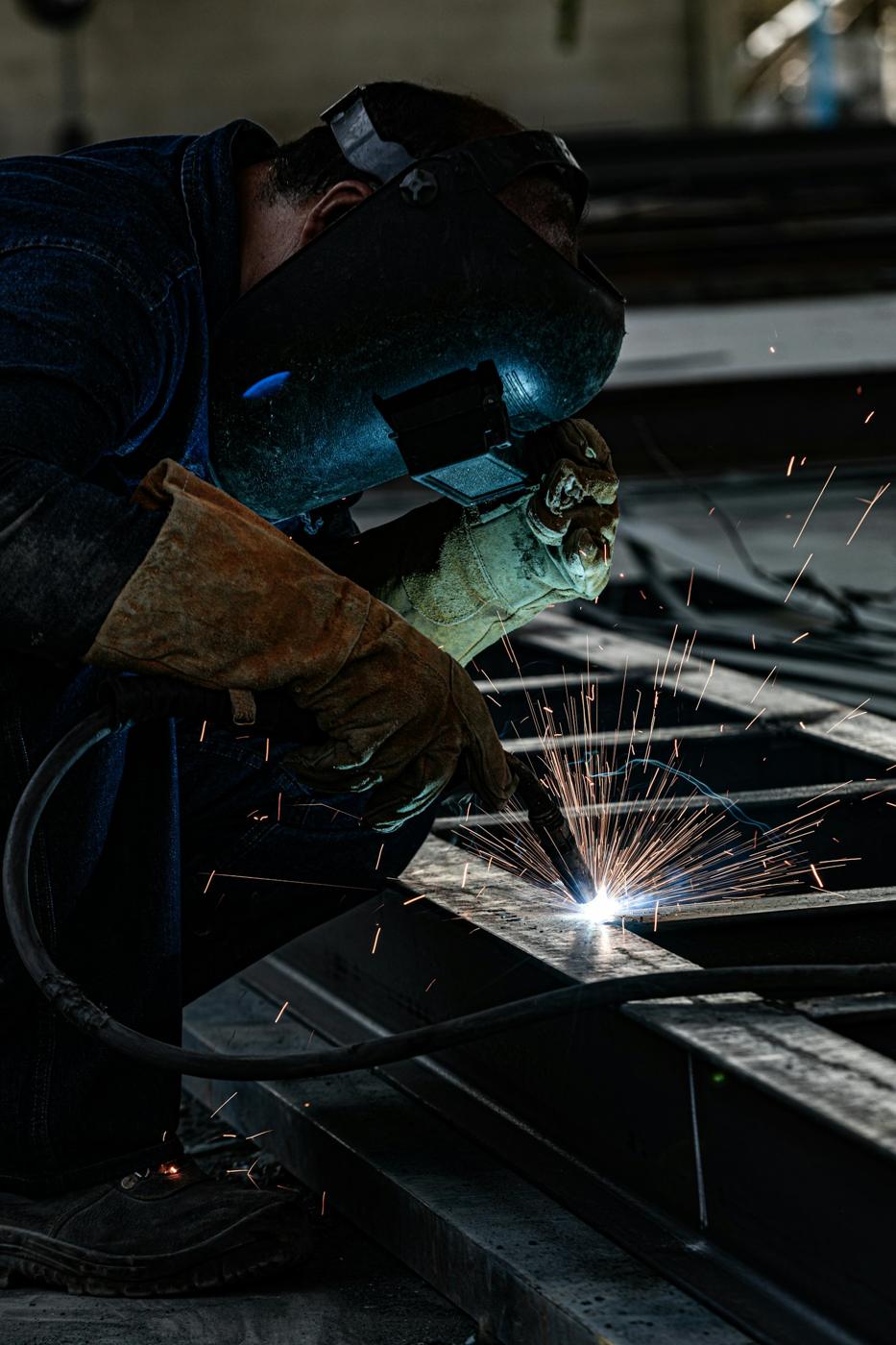 Welder joining a structural steel member